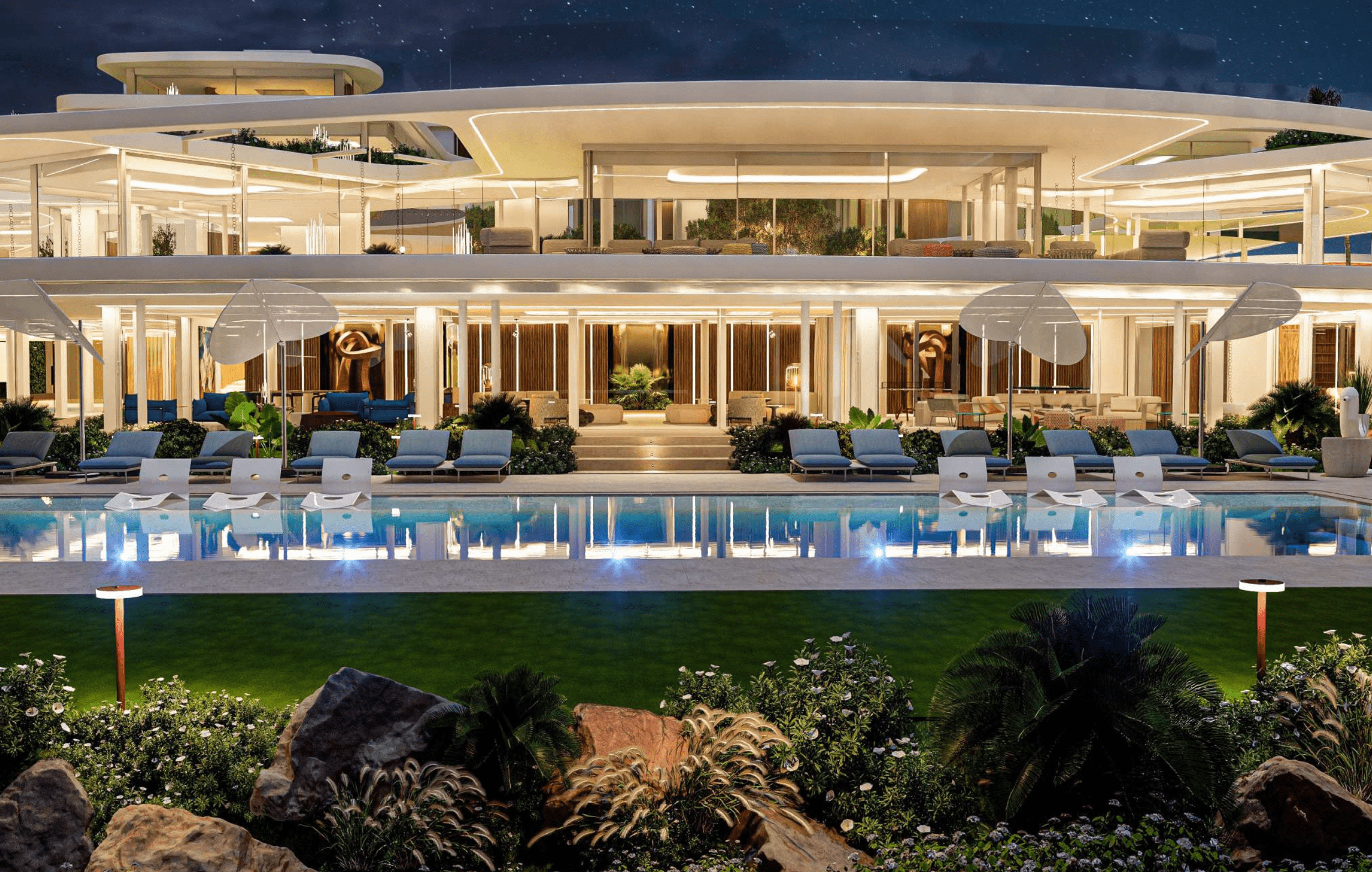 Luxurious modern villa with illuminated pool and lush garden in Sotogrande