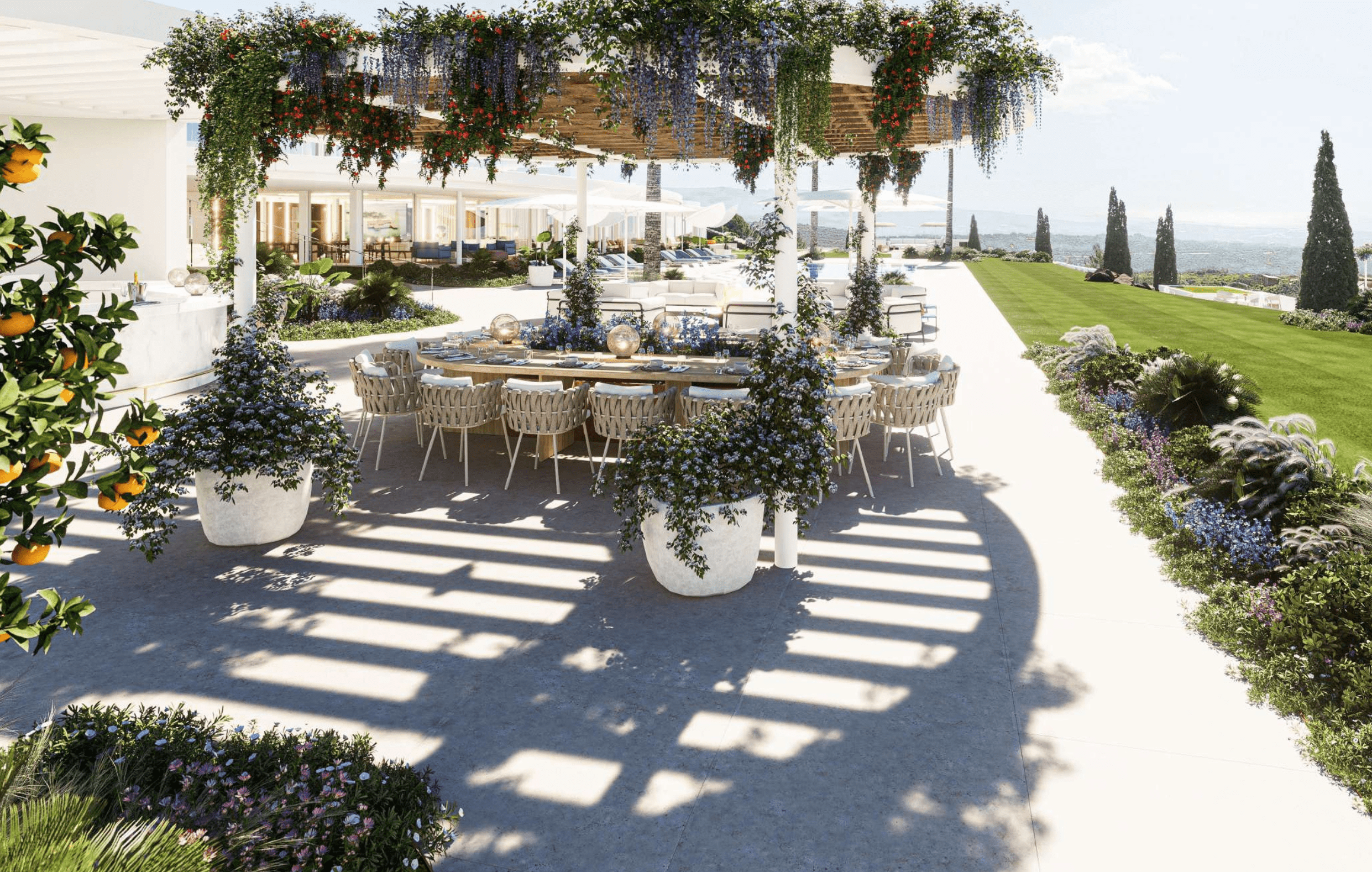 Outdoor dining area under a pergola with lush greenery and scenic views, ideal for family holidays in Sotogrande