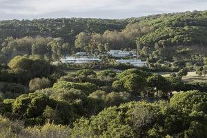 Modern holiday rental villas nestled in the lush green hills of Sotogrande, Spain.
